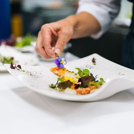 Grand Hotel Villa Castagnola Lugano Kültér fotó A chef finishing a plate