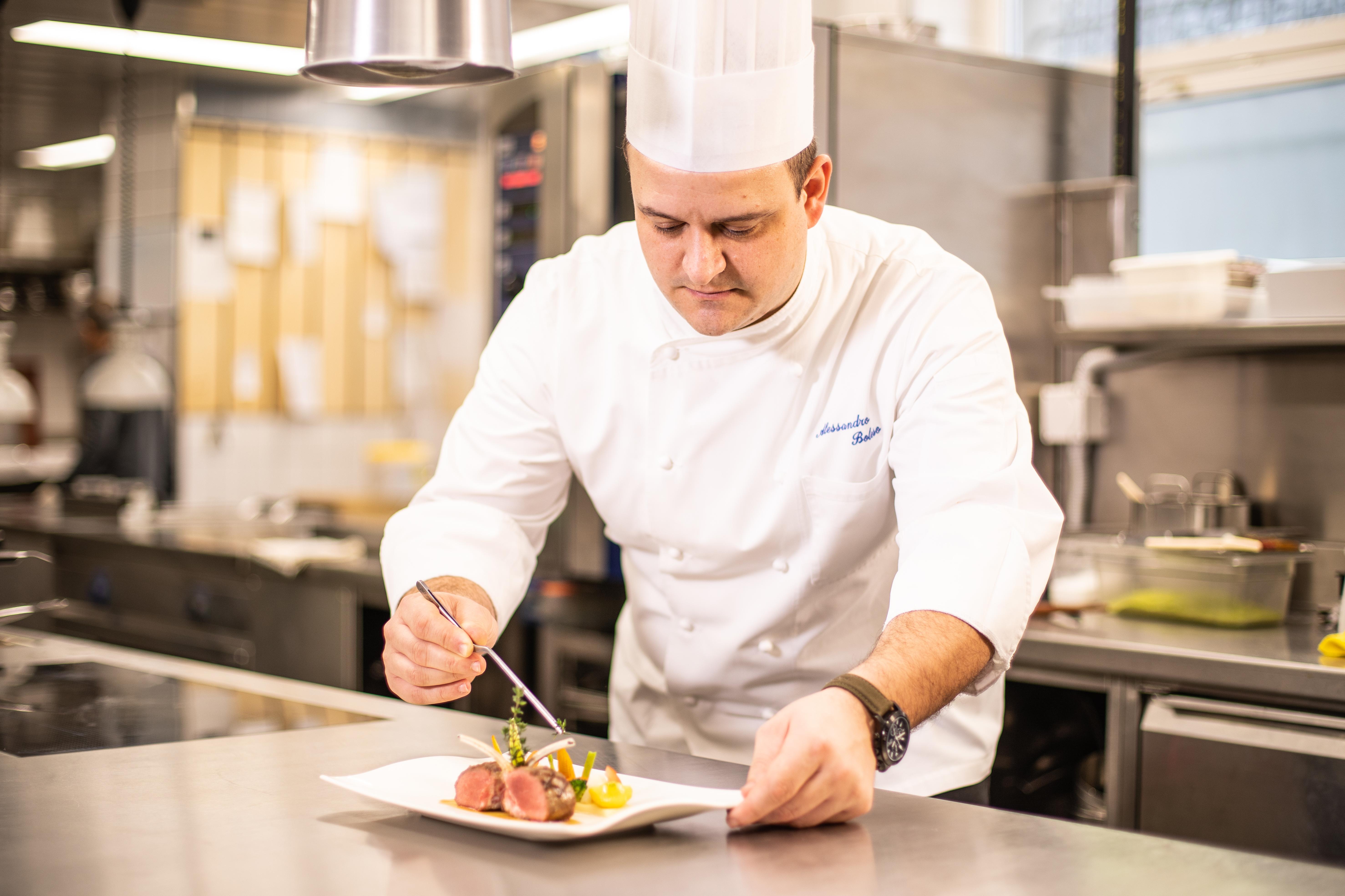 Grand Hotel Villa Castagnola Lugano Kültér fotó A chef preparing a meal
